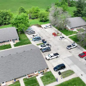 About Teague Roofing Plus | Springfield Mo Roofing Company 3 Aerial view of an apartment complex with asphalt shingle roofs and parking
