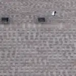 Emergency Roof Repair | Southwest Missouri | Teague Roofing Plus 20 Close aerial detail of an asphalt shingle roof field with vents