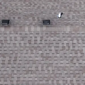 About Teague Roofing Plus | Springfield Mo Roofing Company 5 Close aerial detail of an asphalt shingle roof field with vents