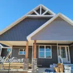 Emergency Roof Repair | Southwest Missouri | Teague Roofing Plus 24 Craftsman style gable with board and batten siding and stone accent