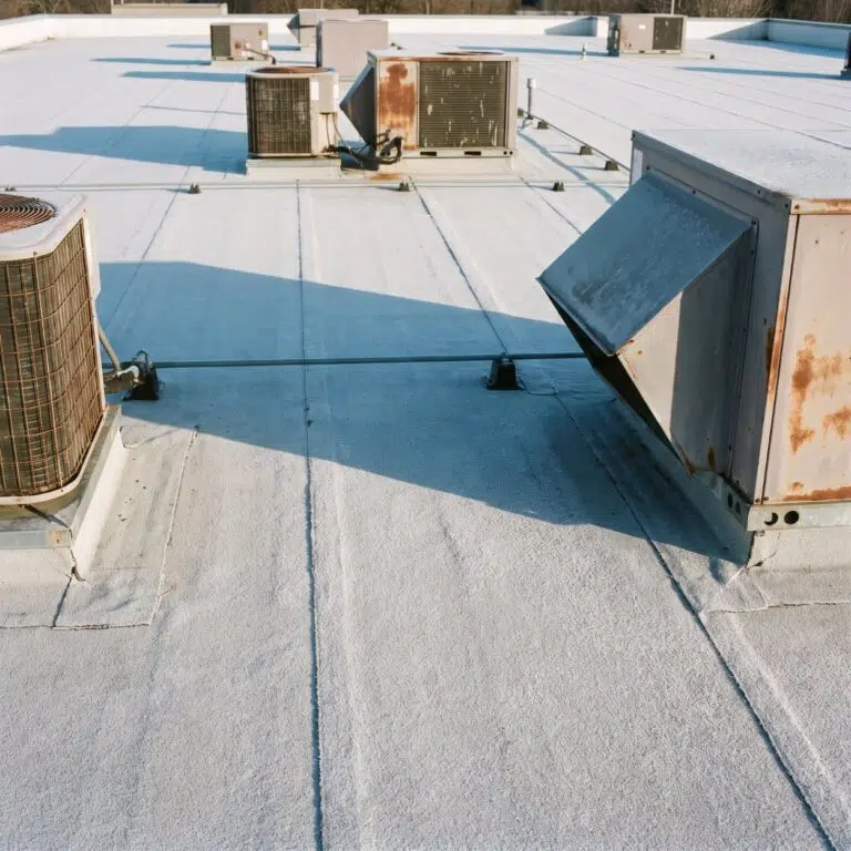 Commercial roof drain cleared of debris during winter preparation