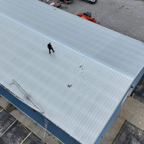 Teague Roofing Plus doing Commercial Metal Roof Repair on Morton Building